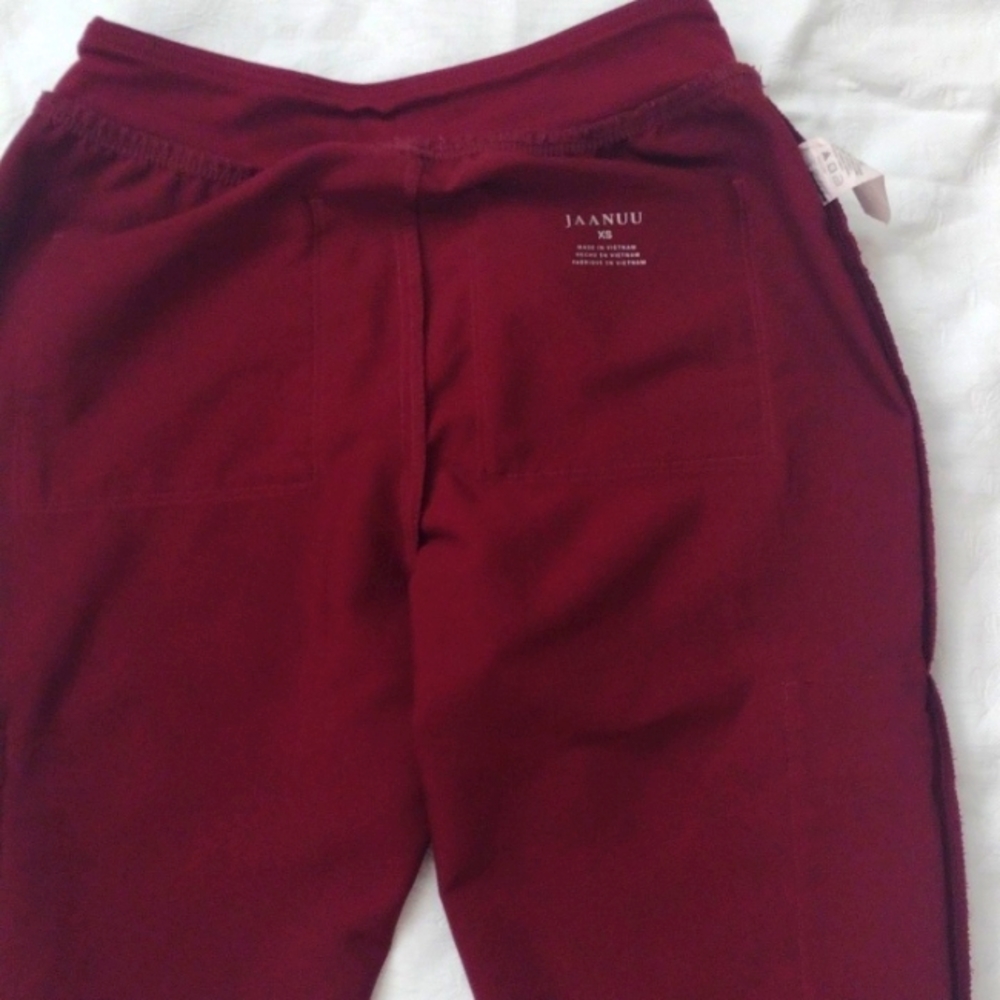 Scrub pants by jaanuu. XS, maroon color